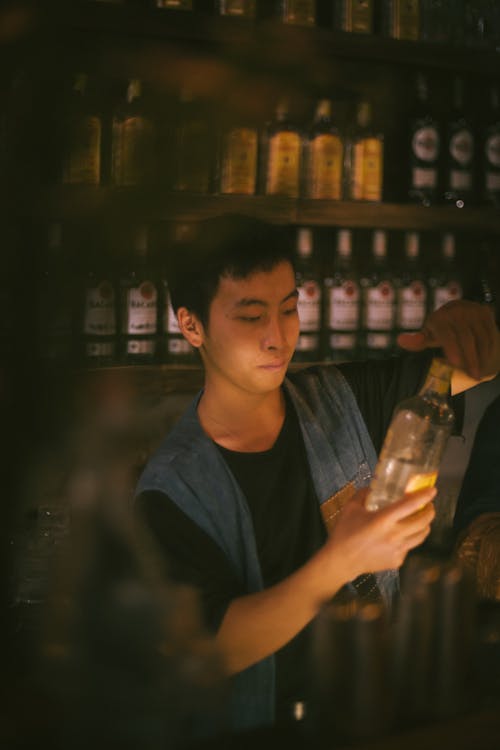 Bartender with Bottle of Alcohol