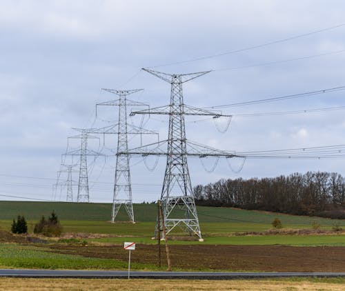 Steel Lattice Transmission Towers of High Voltage Grid on Fields