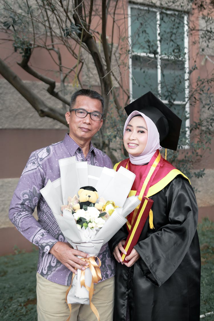 Portrait Of Father With Graduate Daughter