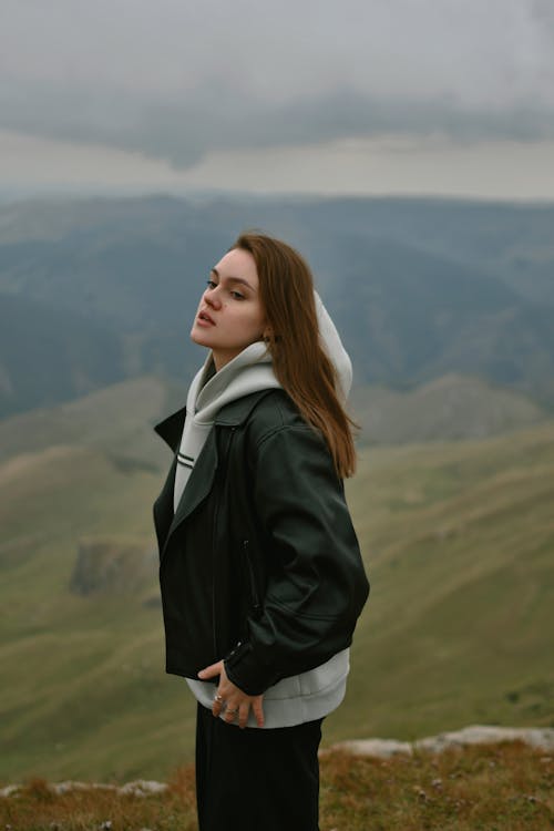 Woman in Jacket on Hill