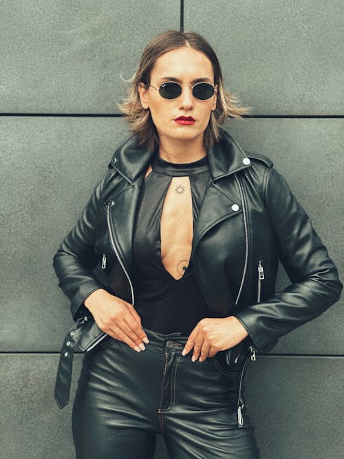 Portrait of Woman in Sunglasses and Leather Jacket