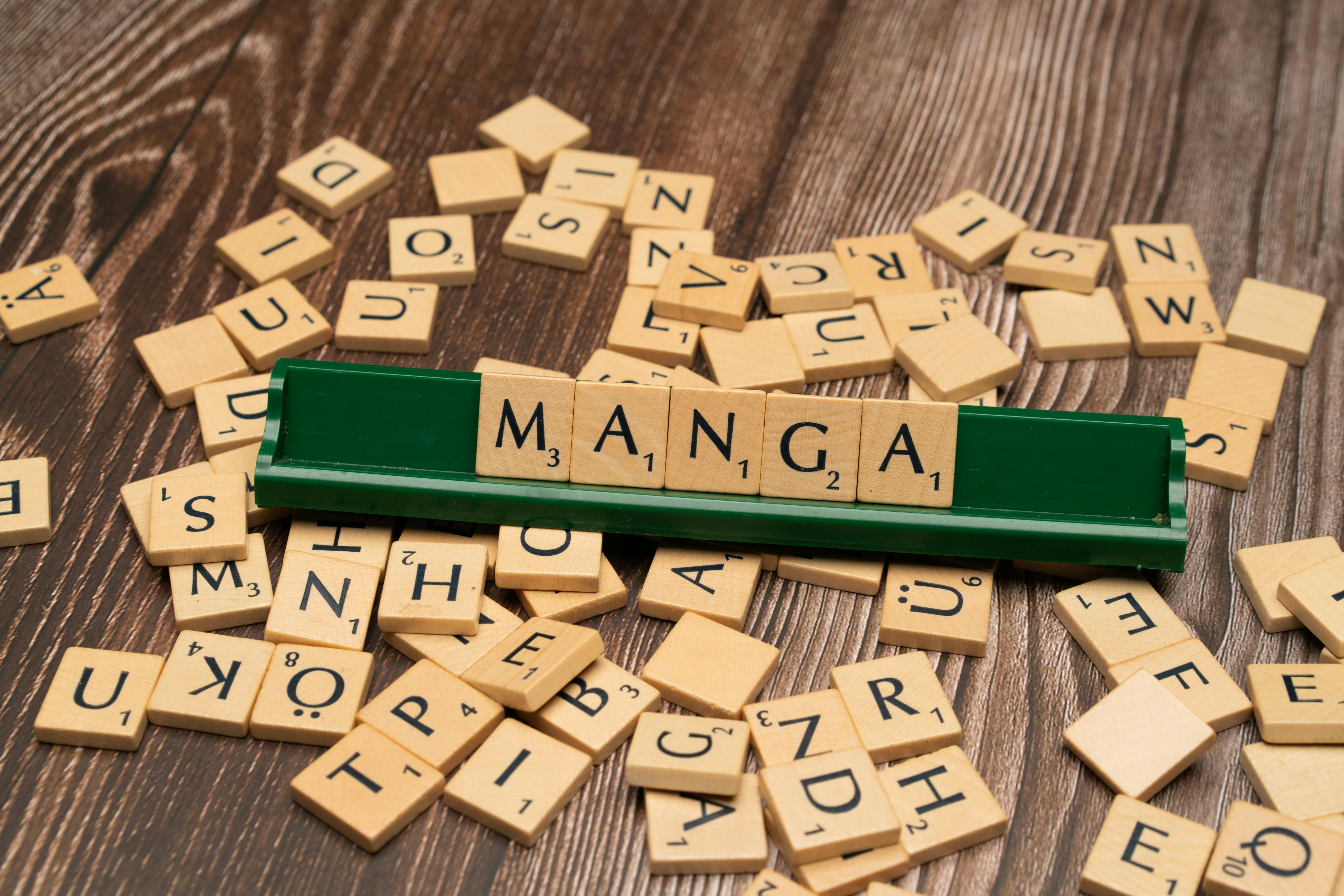 the word manga is spelled out with scrabble tiles