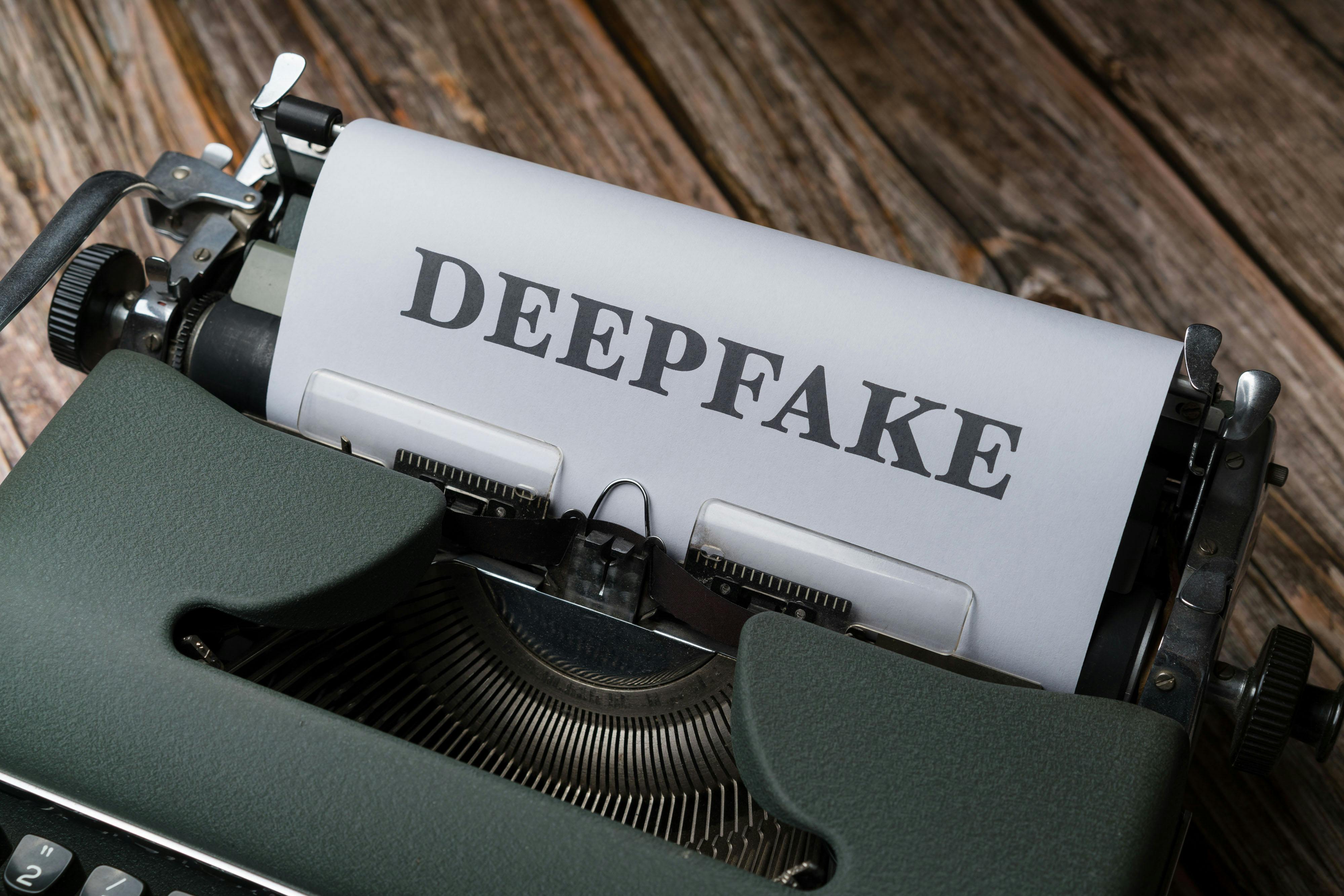 a typewriter with the word deepfake on it