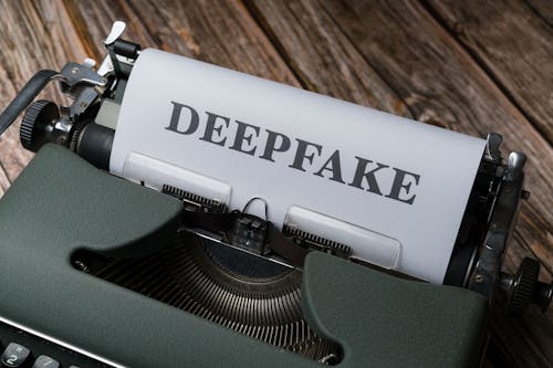 A typewriter with the word deepfake on it