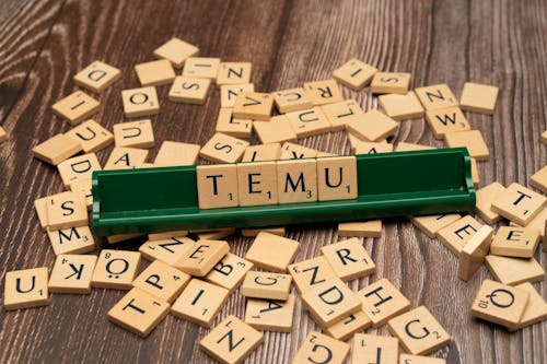 Free The word tiem is spelled out with scrabble tiles Stock Photo