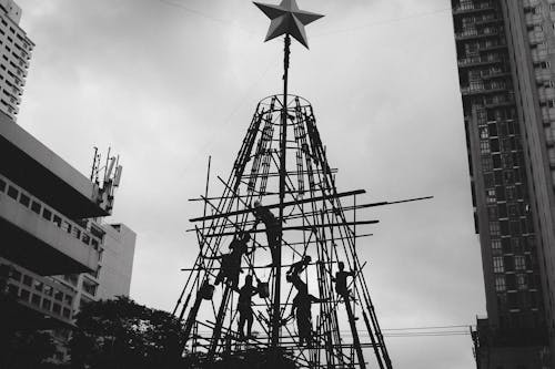 Workers Working on Christmas Tree Scaffolding in City