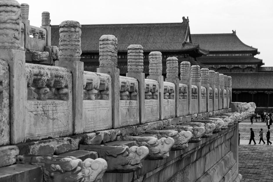 Black and white photo of the intricate architecture at the Forbidden City in Beijing, China.