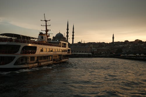 Ferry Sailing on Sea Coast in Istanbul at Sunset