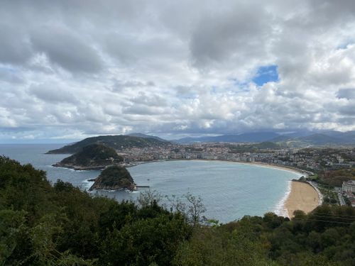 Free Breathtaking aerial view of the famous La Concha Bay, San Sebastian, showcasing the coastline and cityscape under a cloudy sky. Stock Photo