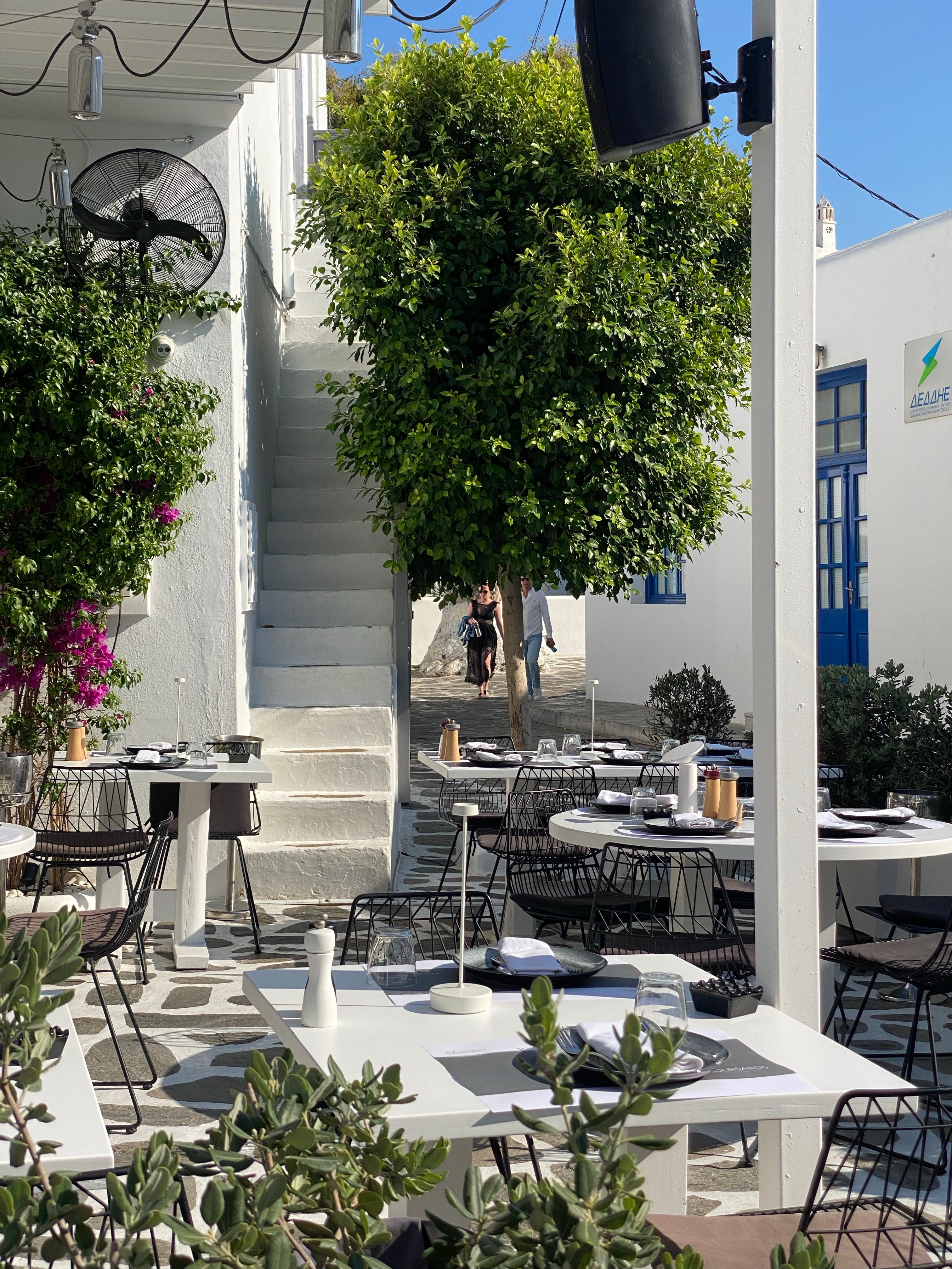 A Greek island restaurant patio overlooking the sea