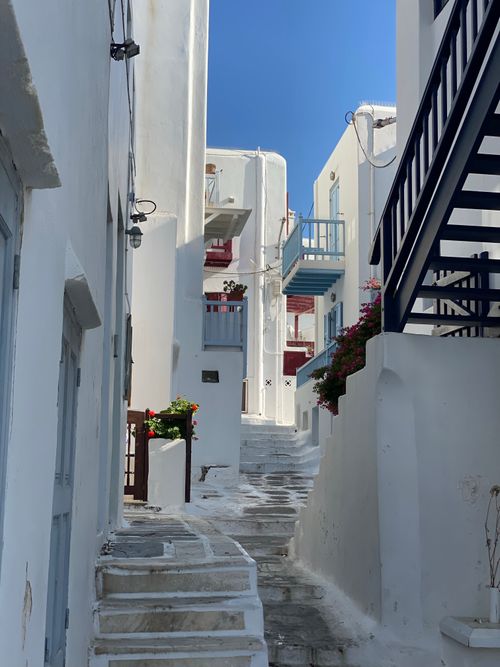 Free Picturesque narrow alley with white architecture in Mykonos, Greece. Stock Photo