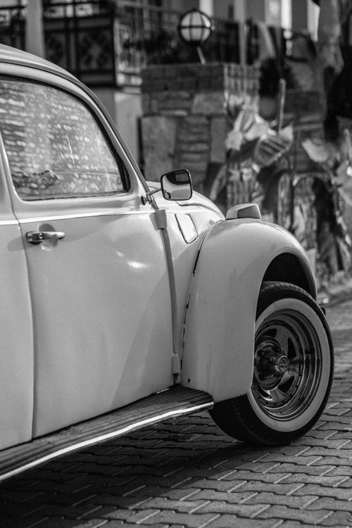 Free Classic vintage Beetle car captured in an old-fashioned black and white style. Stock Photo