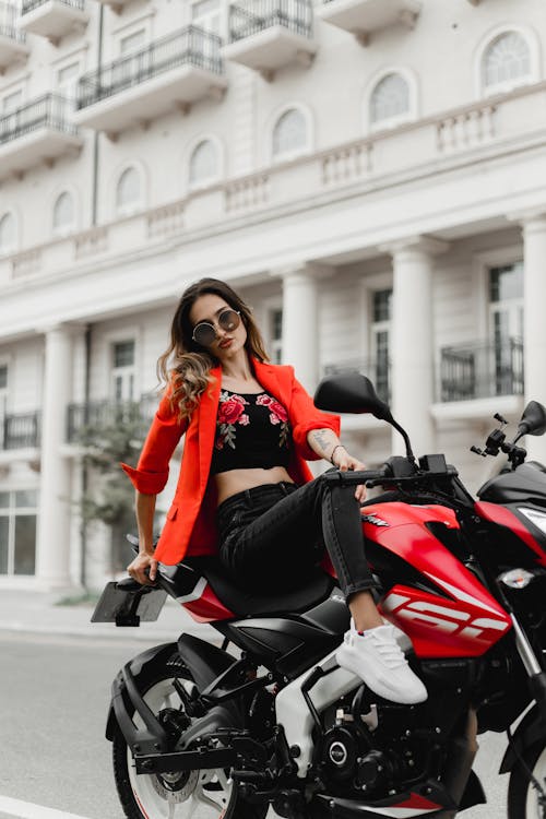 Woman Posing on Motorbike on Street