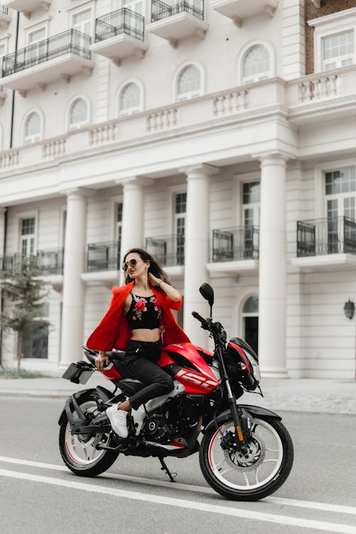 Woman on Motorbike on Street