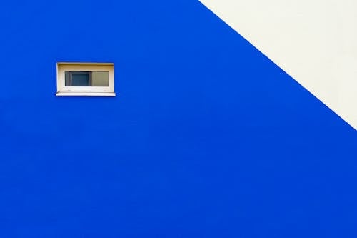 Blue Wall with Small, Closed Window