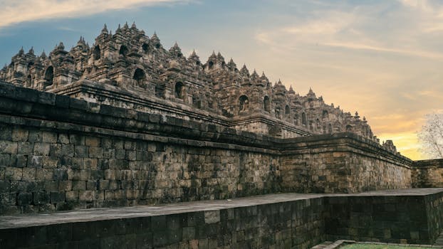 Stunning view of the ancient Borobudur Temple during sunset in Central Java, Indonesia.