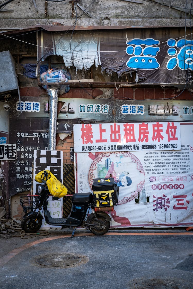 Advertisements On Wall In Alley In Town