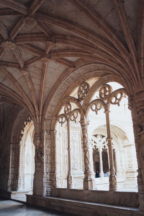 Free Intricate Gothic arches and stone carvings in historic monastery interior. Stock Photo