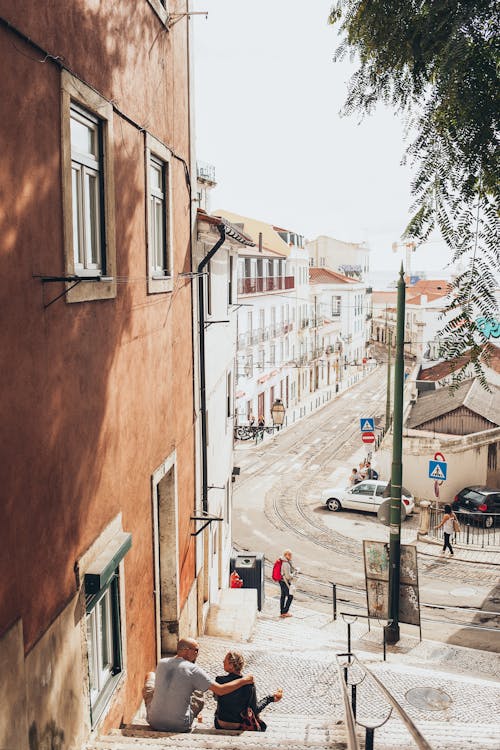 View Of A Town With People Outside