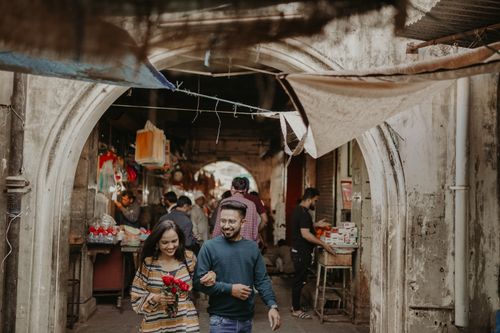 Free A joyful couple strolling through a bustling bazaar in Vadodara, India. Stock Photo