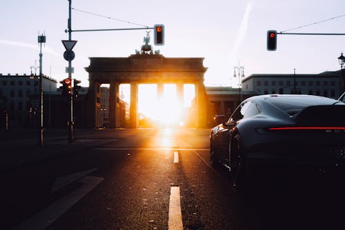 Sports Car near Brandenburg Gate at Sunset