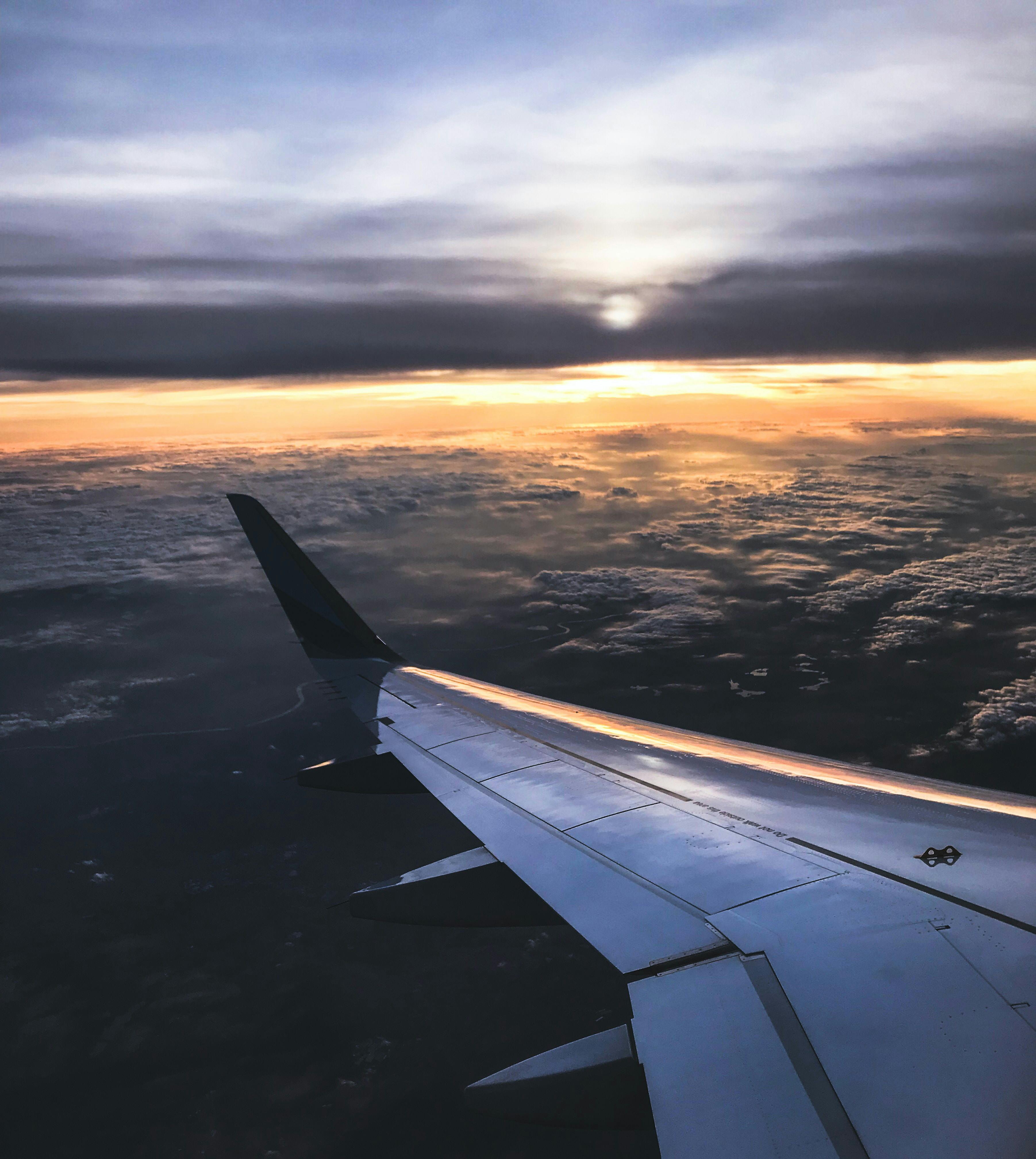 Silhouette Photo of Man Throw Paper Plane · Free Stock Photo