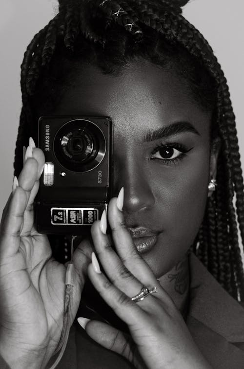 Portrait of Woman Taking Pictures with Camera in Black and White