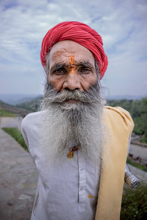 Free Portrait of a Senior Man Wearing a Red Turban Stock Photo