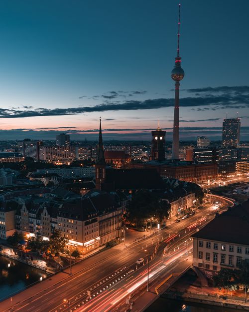Free Captured in Berlin, this cityscape features the iconic TV Tower illuminated against a dramatic sunset sky. Stock Photo