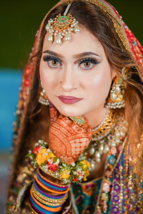 Portrait of a Woman Wearing Traditional Decorative Clothing and Jewellery