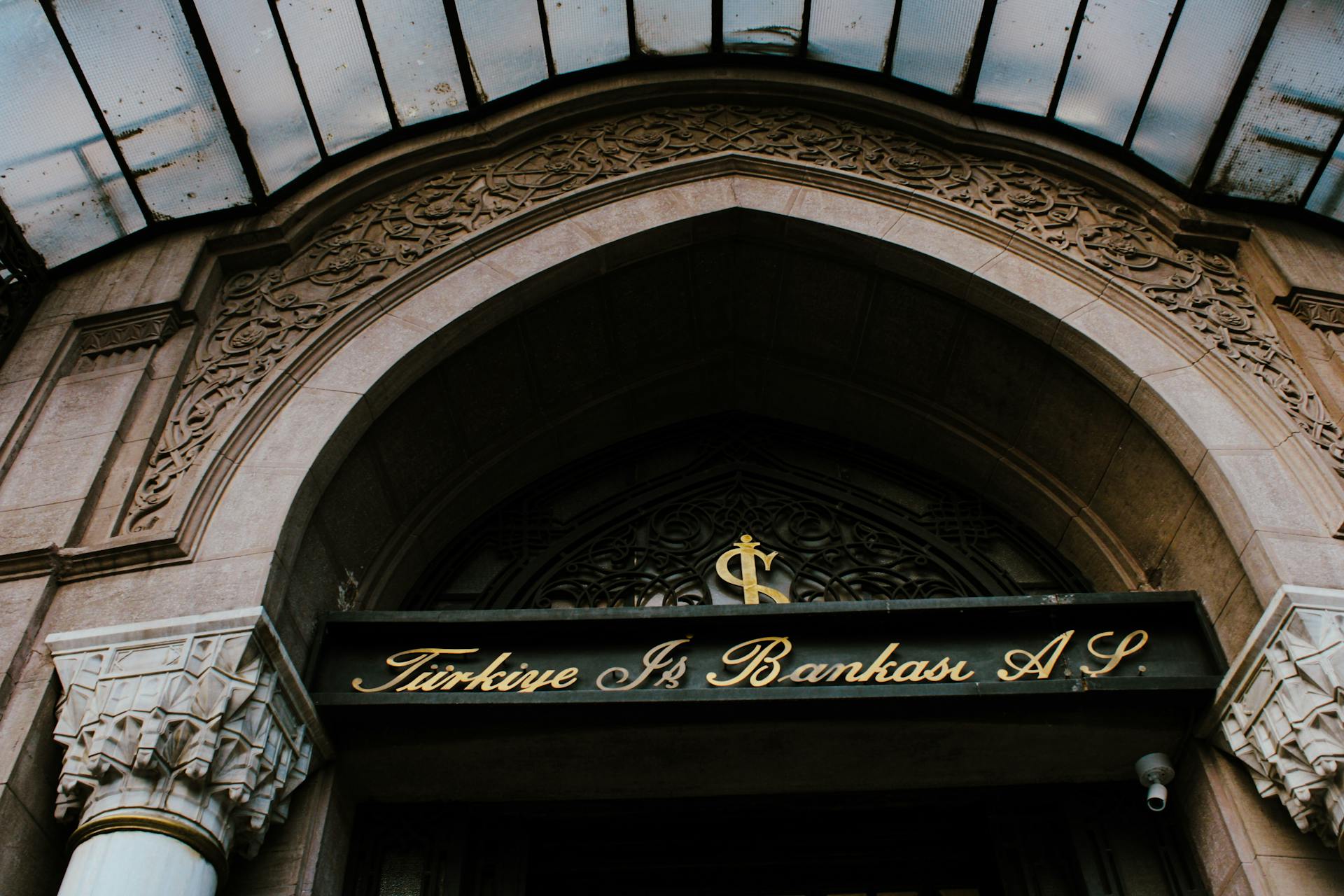 Elegant entrance of Türkiye İş Bankası with architectural details in Istanbul.