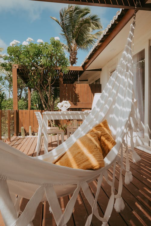 A hammock on the deck of a house