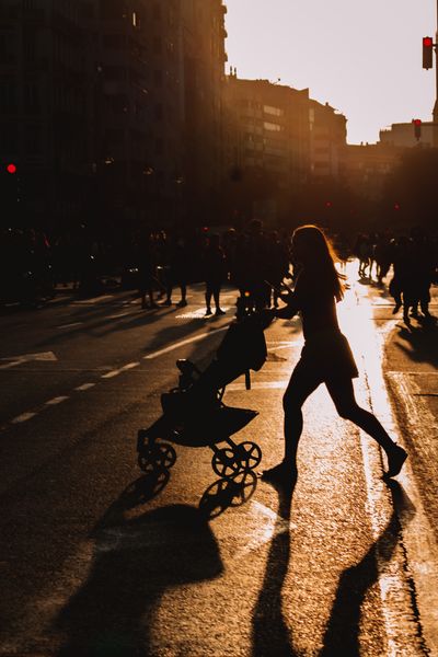 Figure walking a road at sunset, photo by Sofia Marquet on Pexels