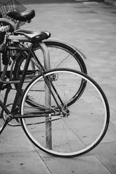 A classic retro bicycle parked on a street in Valencia, Spain.