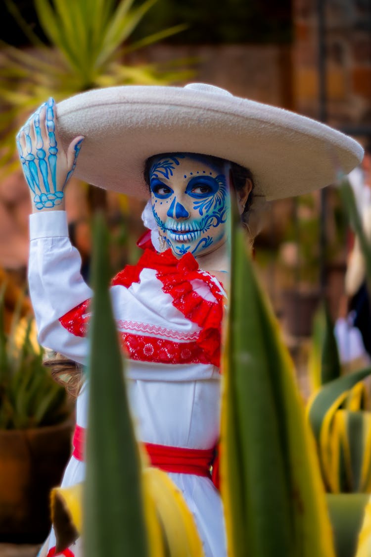 Woman With Traditional Mexican Mask And Sombrero