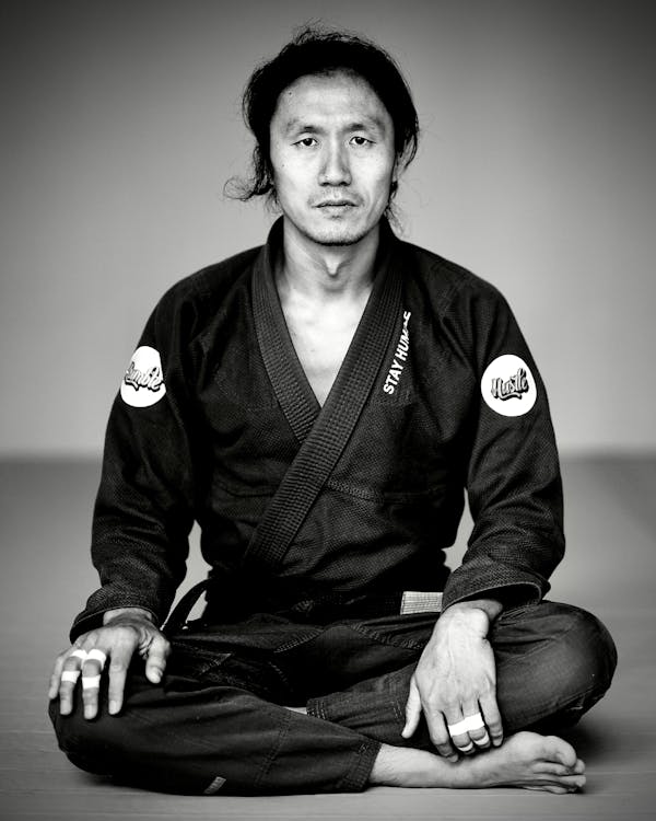 Free Man in Kimono Sitting on Floor Stock Photo