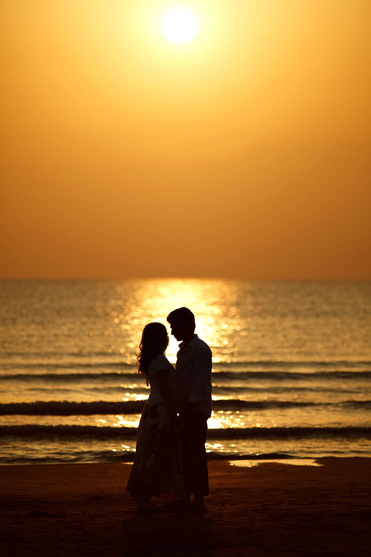 Silhouette of a Romantic Couple on the Beach during Sunset · Free Stock ...