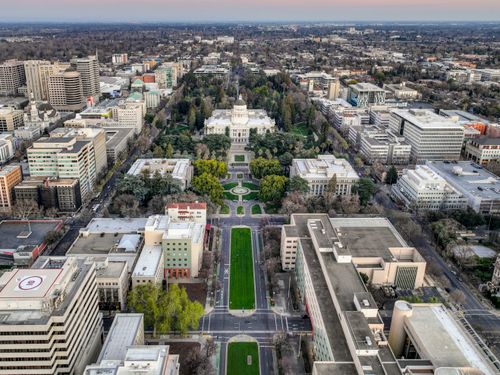 Free Aerial view of downtown Sacramento showcasing the Capitol Building and surrounding cityscape. Stock Photo