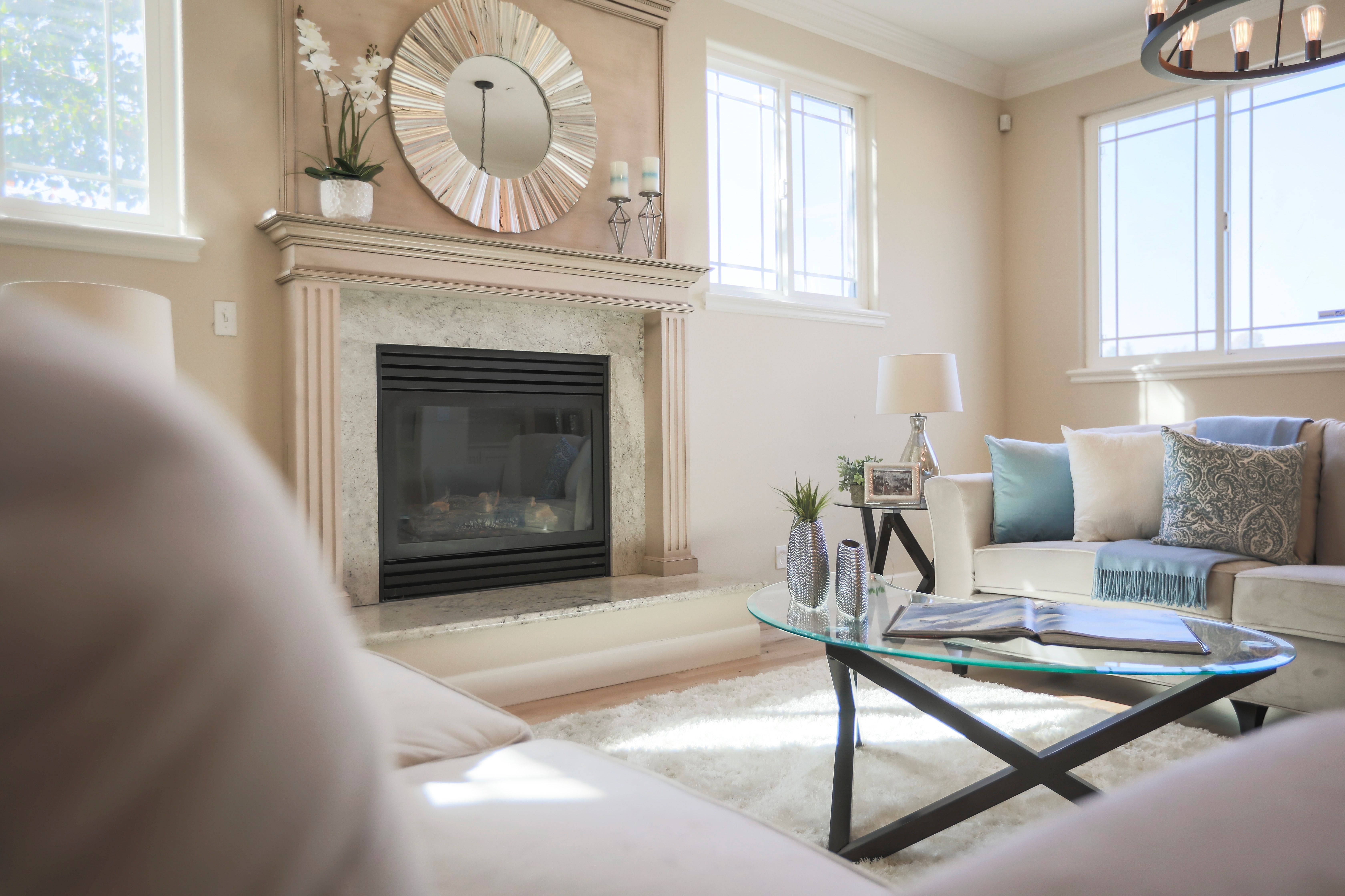 Bright, elegant living room with a stylish custom fireplace installation in a Riverside CA home