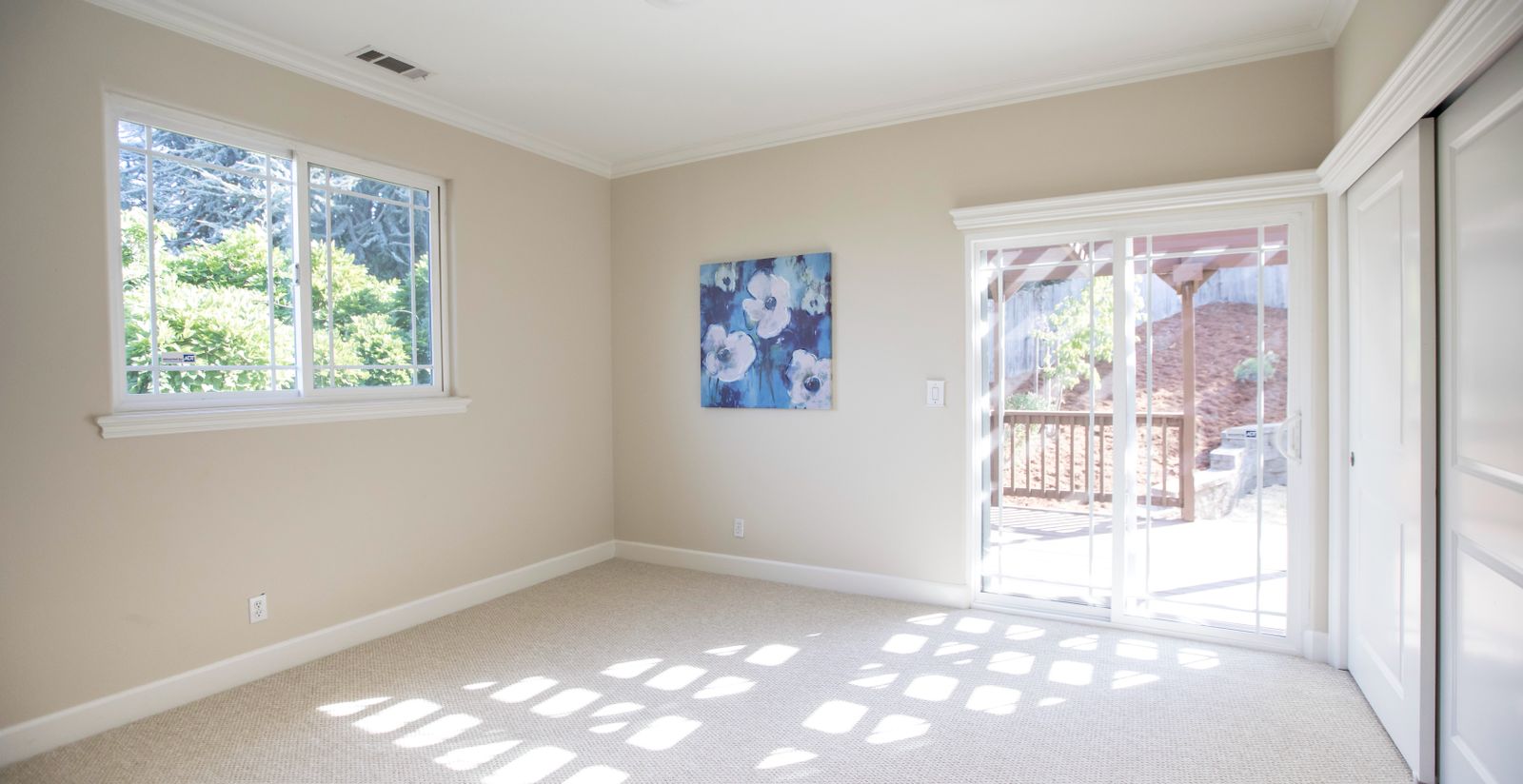 Tall windows in a bright room