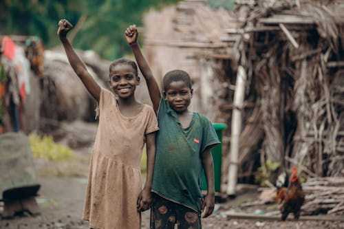 Boy and Girl with Raised Fists