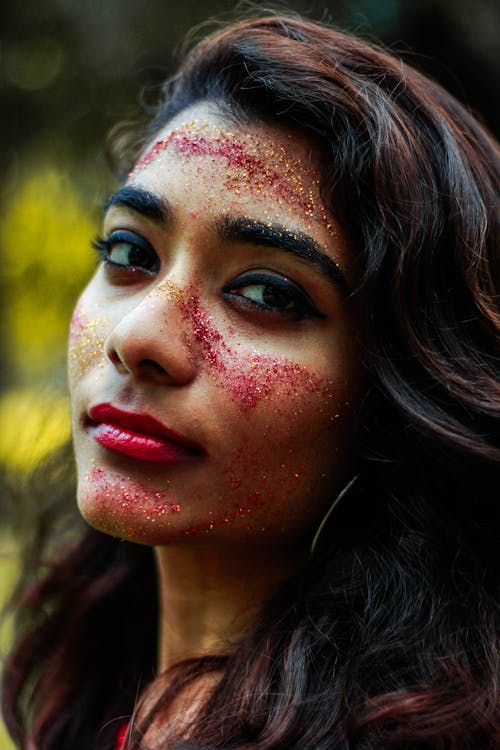 Close-Up Photo of Woman With Glitters On her Face