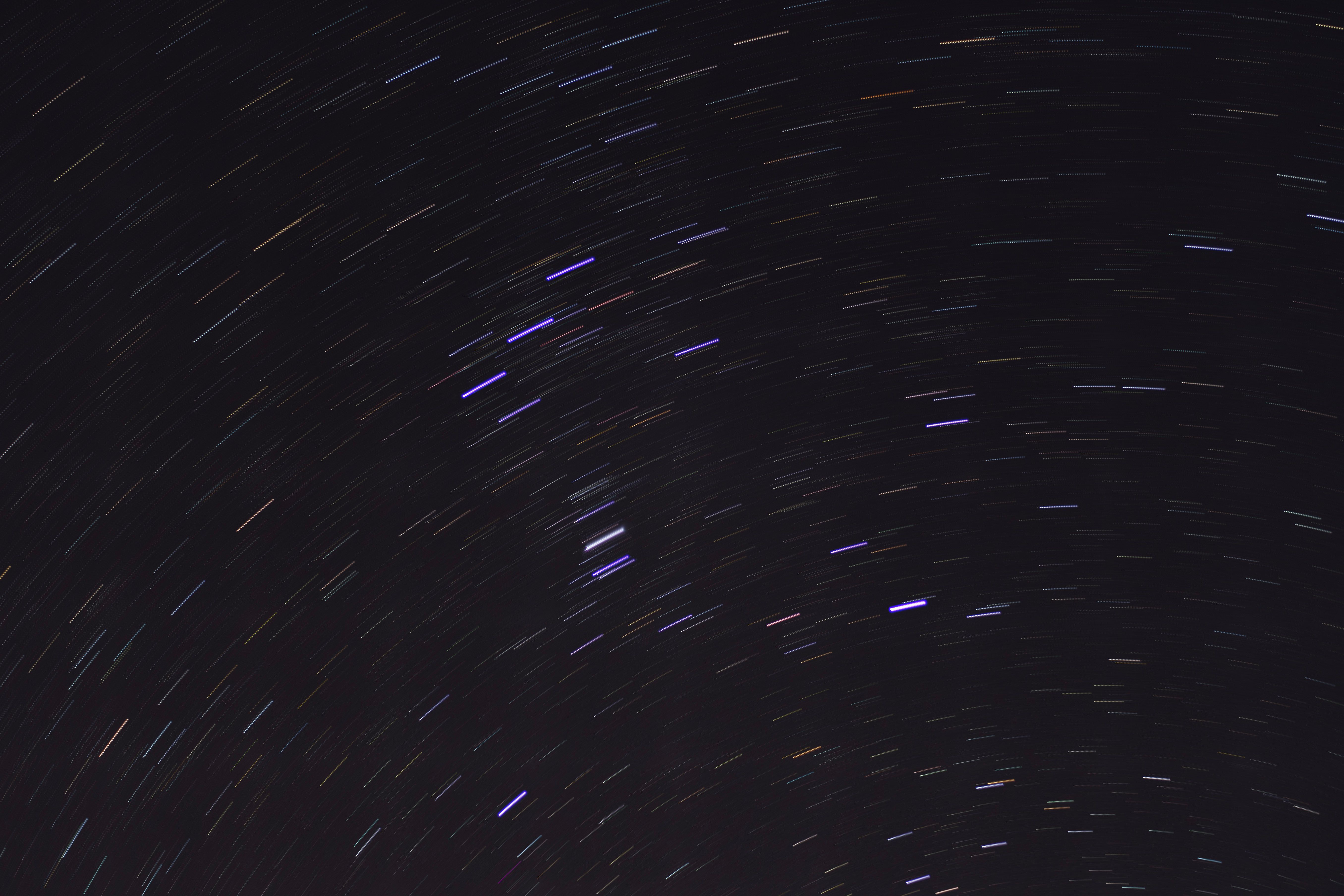 A long exposure of stars and trails in the sky · Free Stock Photo