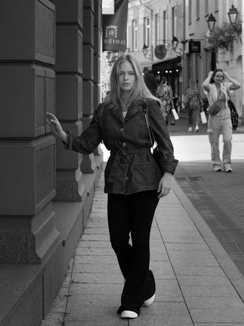 Blonde Model in Jacket Posing on Sidewalk