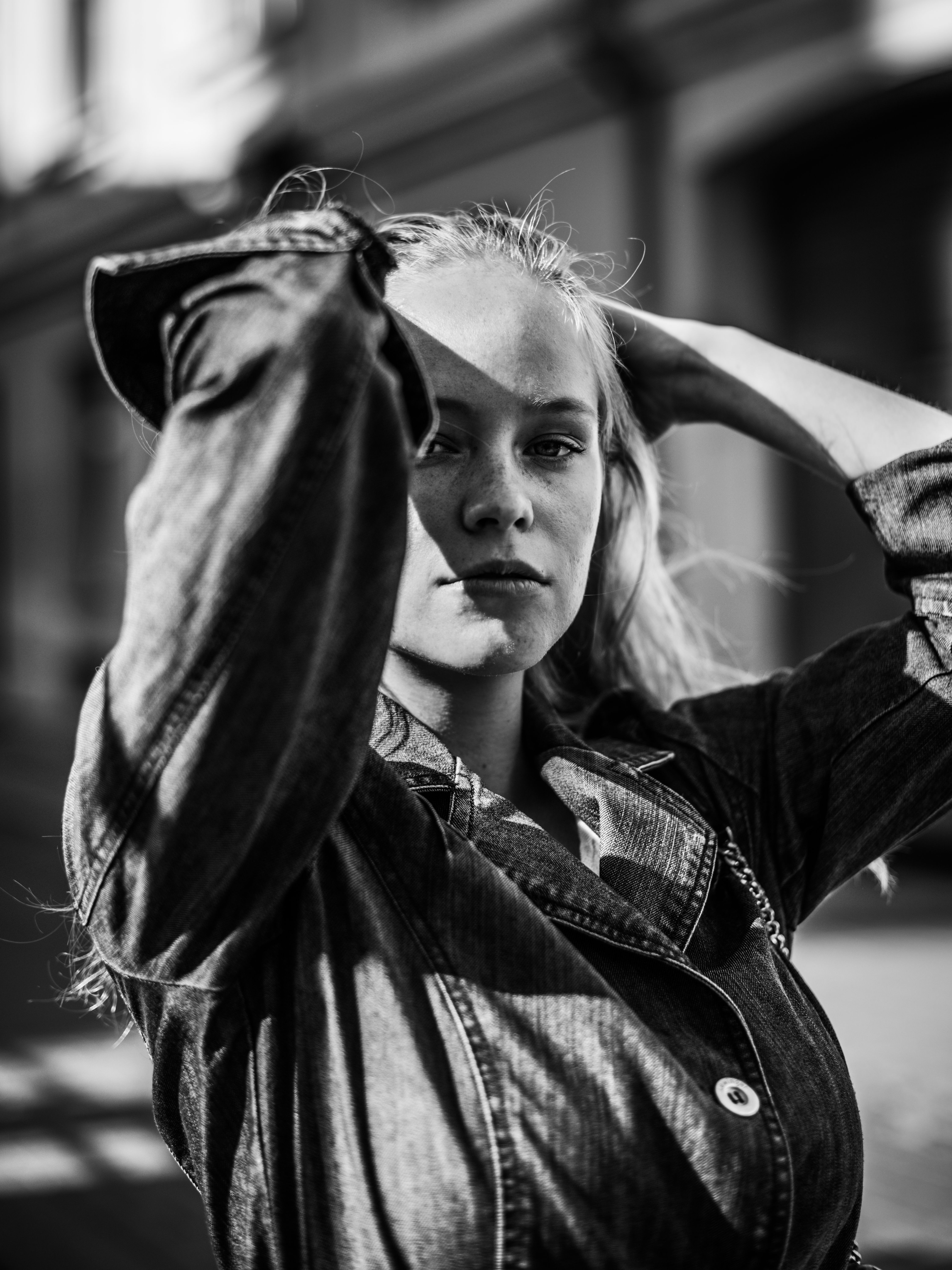 Stylish black and white portrait of a woman outdoors in Vilnius, Lithuania.