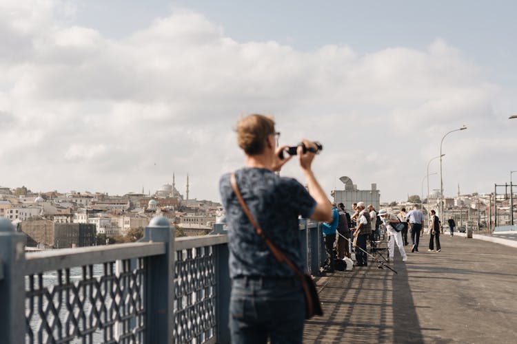 Person Taking Pictures On Galata Bridge