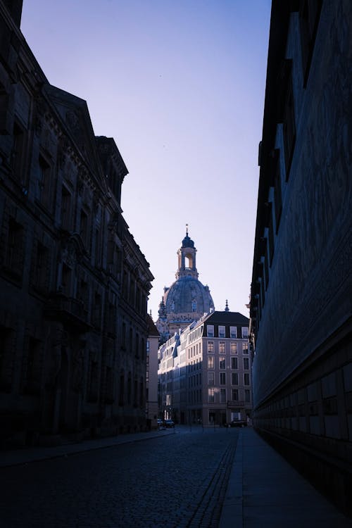 Tower of Frauenkirche Dresden behind Street