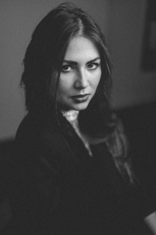 A woman with long hair and a black and white photo