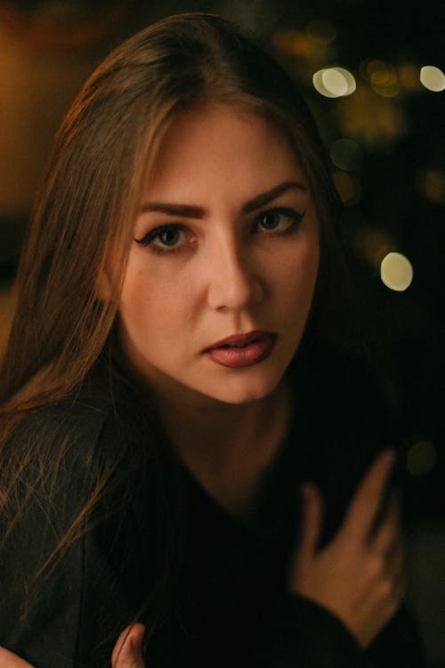 A woman with long hair and a black shirt