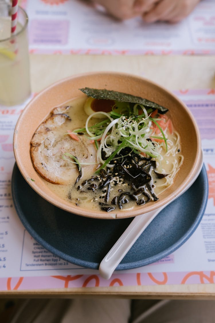 Ramen With Pork And Seaweeds On Table In Restaurant